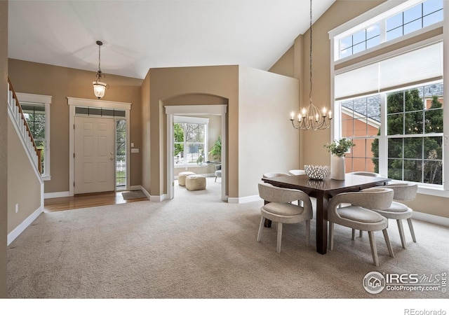 3122 Notabon Ct, Lafayette, CO 80026 - dining space featuring carpet floors, a chandelier, and a wealth of natural light