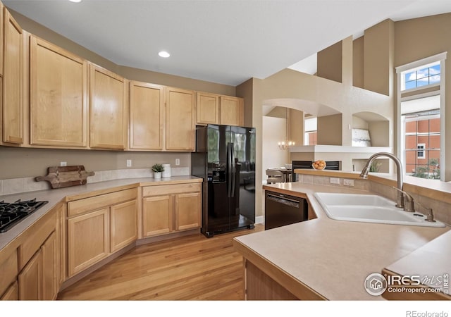 3122 Notabon Ct, Lafayette, CO 80026 - kitchen with light countertops, a sink, black appliances, and light brown cabinets