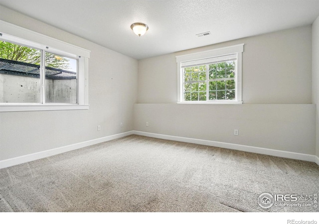 3122 Notabon Ct, Lafayette, CO 80026 - empty room with a healthy amount of sunlight, carpet floors, baseboards, and visible vents