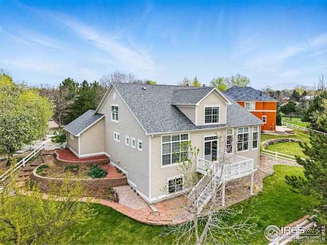 3122 Notabon Ct, Lafayette, CO 80026 - rear view of house with a yard, a shingled roof, stairs, and a wooden deck