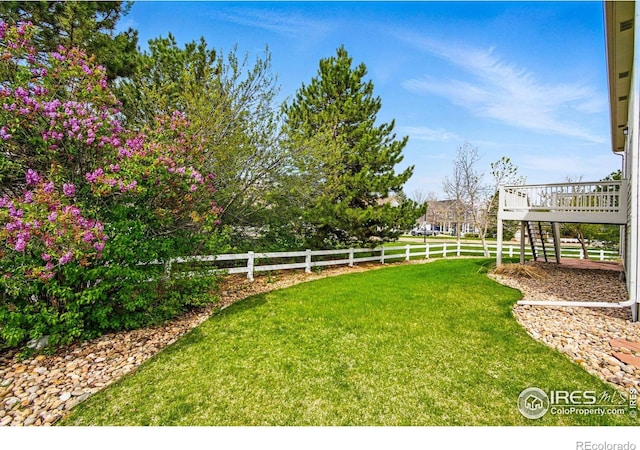 3122 Notabon Ct, Lafayette, CO 80026 - view of yard featuring fence, a deck, and stairway