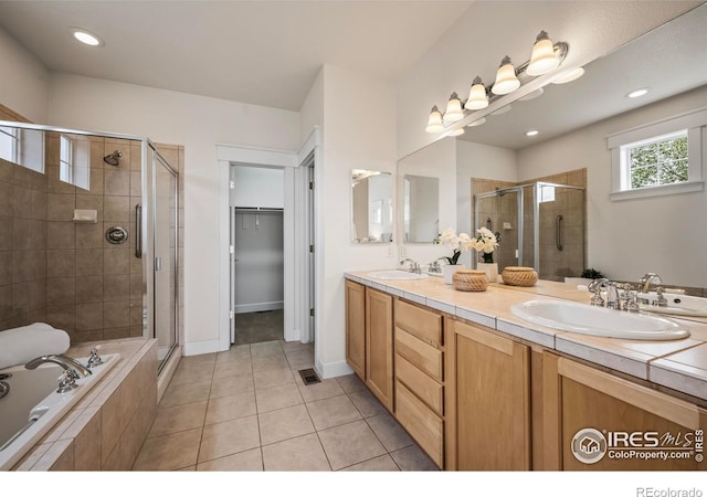 3122 Notabon Ct, Lafayette, CO 80026 - bathroom featuring double vanity, a sink, tile patterned floors, and a shower stall