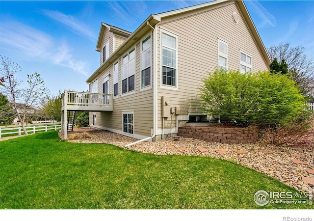 3122 Notabon Ct, Lafayette, CO 80026 - rear view of house with stairway, fence, a yard, and a deck