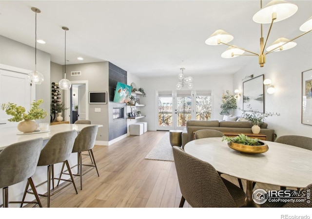 267 Clementina St, Louisville, CO 80027 - dining room featuring light wood-type flooring, baseboards, visible vents, recessed lighting, and a chandelier