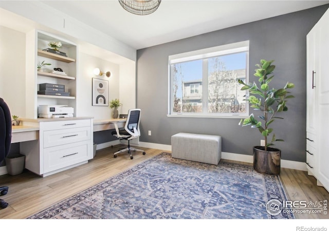 267 Clementina St, Louisville, CO 80027 - office space with built in study area, baseboards, and light wood-type flooring