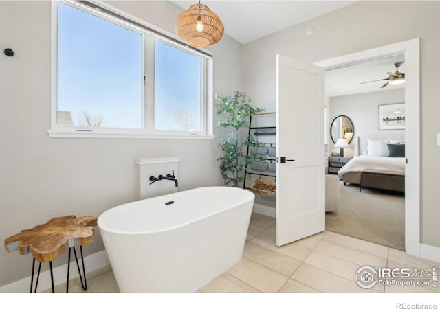 267 Clementina St, Louisville, CO 80027 - bathroom featuring a freestanding bath, ensuite bathroom, baseboards, tile patterned flooring, and ceiling fan