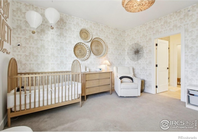 267 Clementina St, Louisville, CO 80027 - carpeted bedroom featuring wallpapered walls and a nursery area