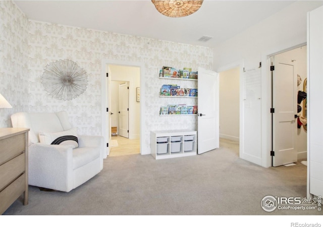 267 Clementina St, Louisville, CO 80027 - sitting room with wallpapered walls, baseboards, visible vents, and carpet floors