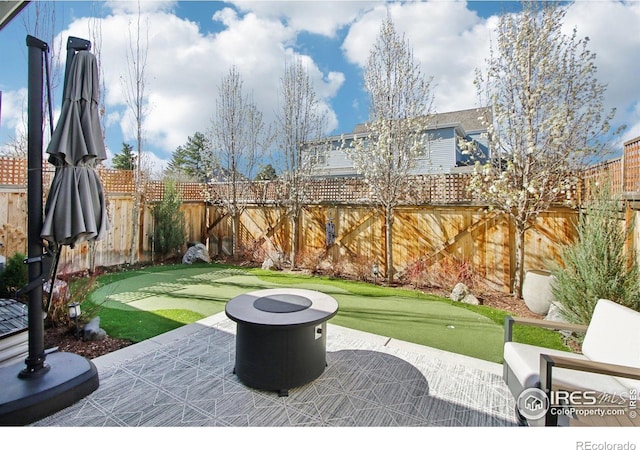 267 Clementina St, Louisville, CO 80027 - view of patio with a fenced backyard and an outdoor fire pit