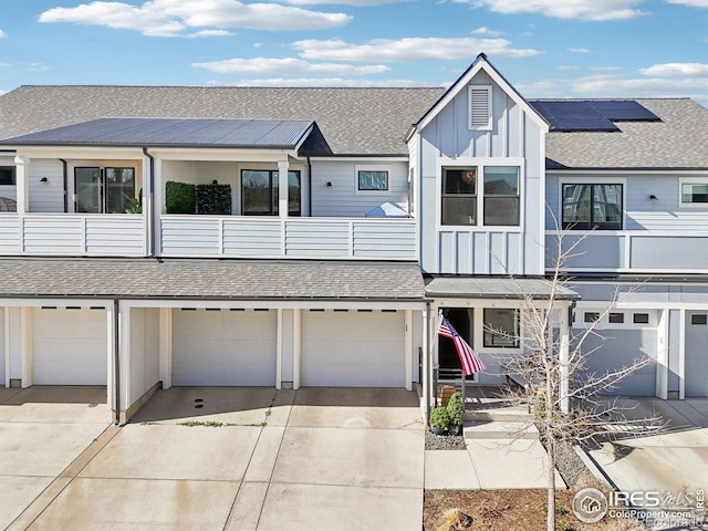 267 Clementina St, Louisville, CO 80027 - multi unit property featuring board and batten siding, an attached garage, driveway, and a balcony