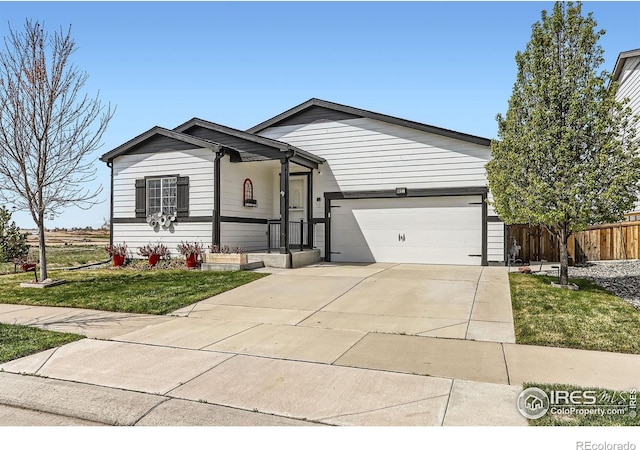 6021 Sandstone Cir, Erie, CO 80516 - single story home with fence, concrete driveway, a front lawn, and a garage