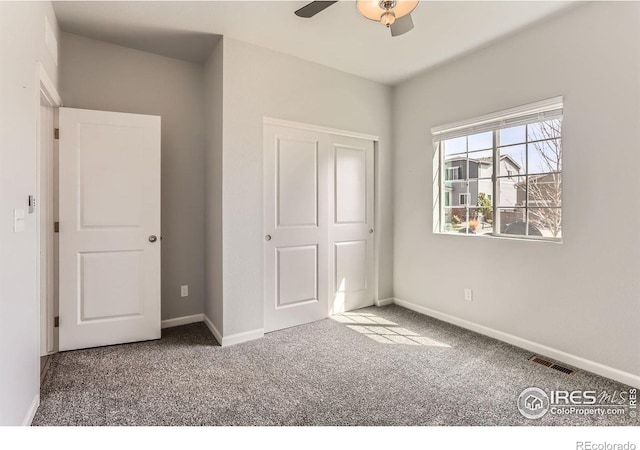 6021 Sandstone Cir, Erie, CO 80516 - unfurnished bedroom featuring baseboards, visible vents, carpet floors, and ceiling fan