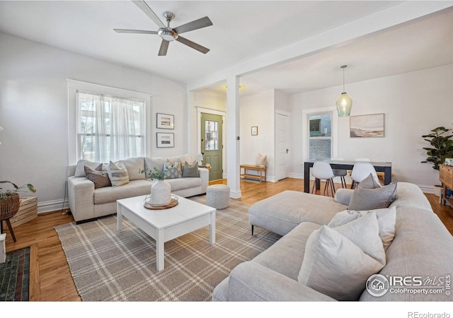 3059 N York St, Denver, CO 80205 - living area with baseboards, ceiling fan, and wood finished floors