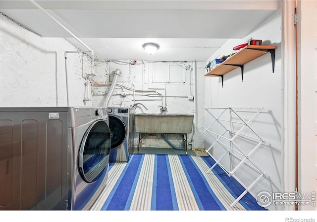 3059 N York St, Denver, CO 80205 - washroom featuring a sink, laundry area, and washing machine and clothes dryer