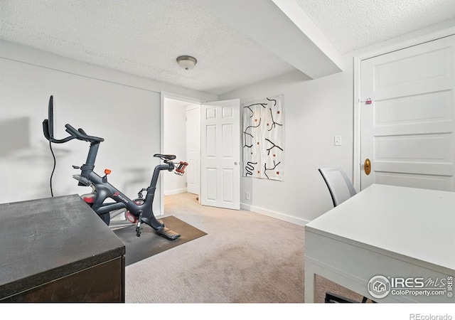 3059 N York St, Denver, CO 80205 - workout area featuring baseboards, a textured ceiling, and light colored carpet