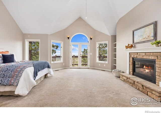 bedroom featuring a fireplace, carpet floors, baseboards, and access to outside