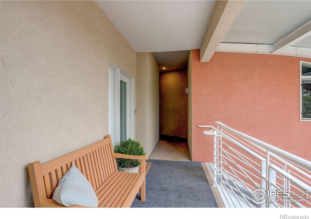 doorway to property with stucco siding