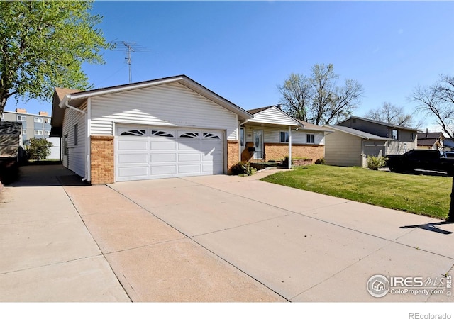ranch-style house featuring brick siding, an attached garage, driveway, and a front yard