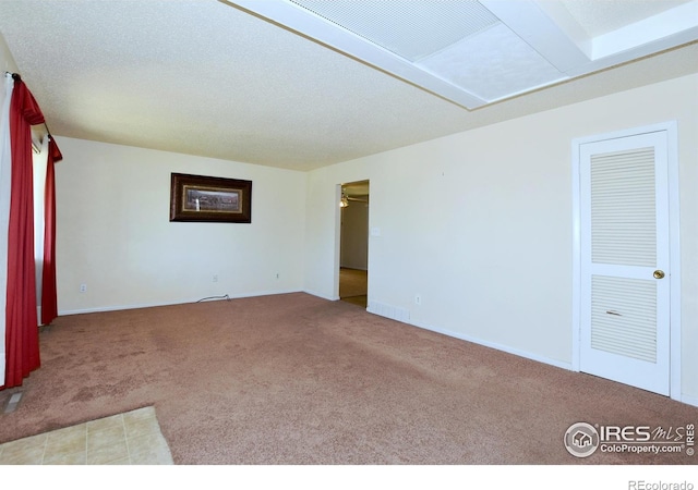 empty room featuring baseboards and carpet floors