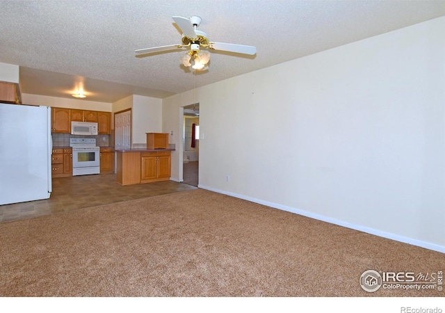 unfurnished living room featuring a textured ceiling, carpet flooring, baseboards, and a ceiling fan