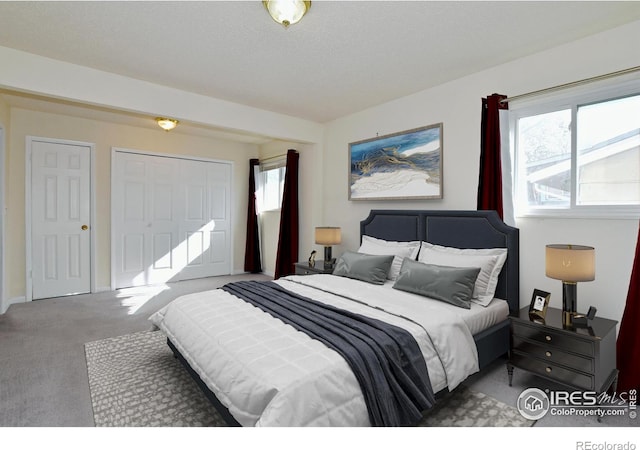 carpeted bedroom with a closet