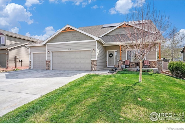 9040 Painted Horse Ln, Wellington, CO 80549 - craftsman house with a garage, stone siding, covered porch, roof mounted solar panels, and a front yard
