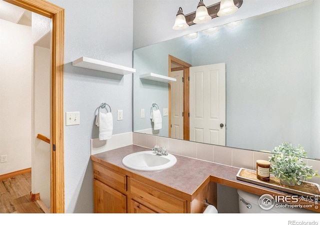 9040 Painted Horse Ln, Wellington, CO 80549 - bathroom with vanity and wood finished floors
