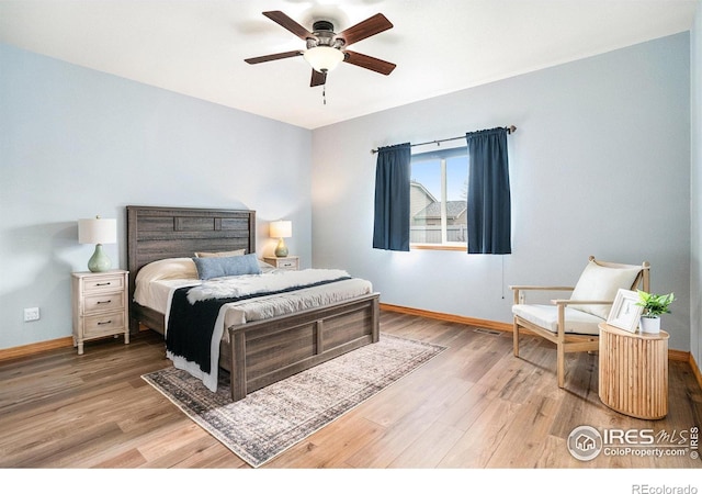 9040 Painted Horse Ln, Wellington, CO 80549 - bedroom featuring wood finished floors, a ceiling fan, and baseboards