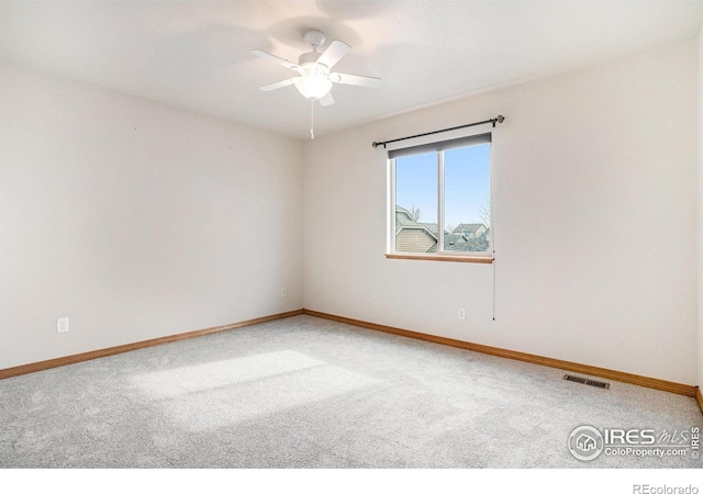 9040 Painted Horse Ln, Wellington, CO 80549 - empty room with baseboards, visible vents, a ceiling fan, and light colored carpet