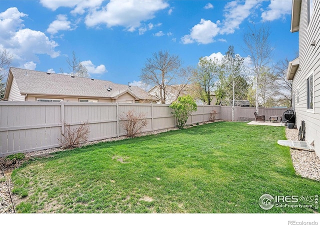 9040 Painted Horse Ln, Wellington, CO 80549 - view of yard featuring a patio area and a fenced backyard