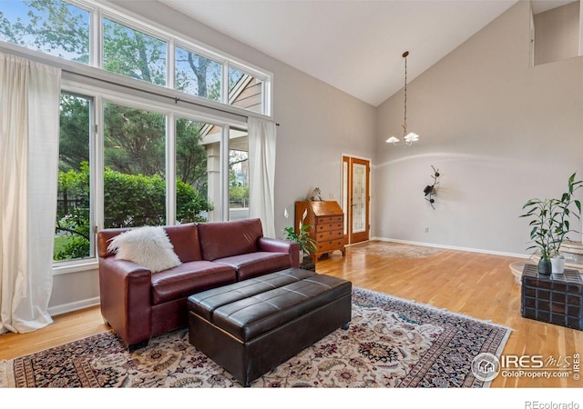 5285 Gallatin Pl, Boulder, CO 80303 - living room with a chandelier, wood finished floors, and a wealth of natural light