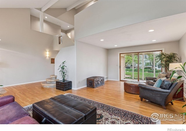 5285 Gallatin Pl, Boulder, CO 80303 - living area featuring baseboards, wood finished floors, vaulted ceiling with beams, and recessed lighting