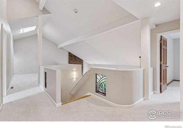 5285 Gallatin Pl, Boulder, CO 80303 - corridor featuring carpet floors, lofted ceiling, an upstairs landing, and baseboards