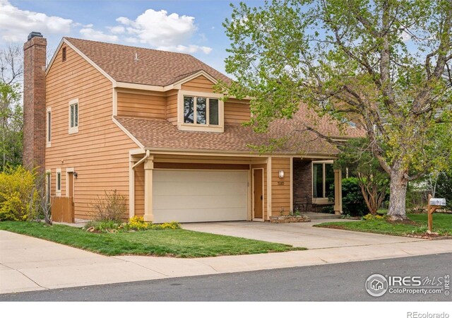 5285 Gallatin Pl, Boulder, CO 80303 - traditional-style house with a chimney, an attached garage, driveway, and roof with shingles