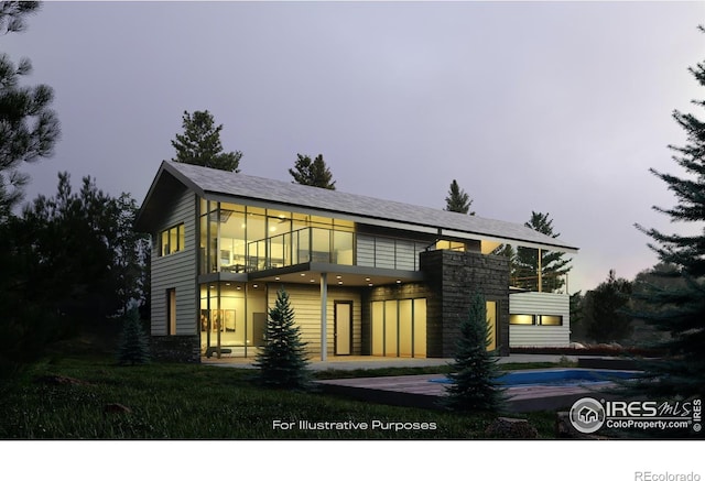 contemporary house featuring a patio and a balcony