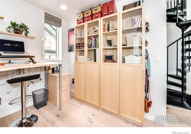 home office with recessed lighting, light wood-style flooring, and baseboards