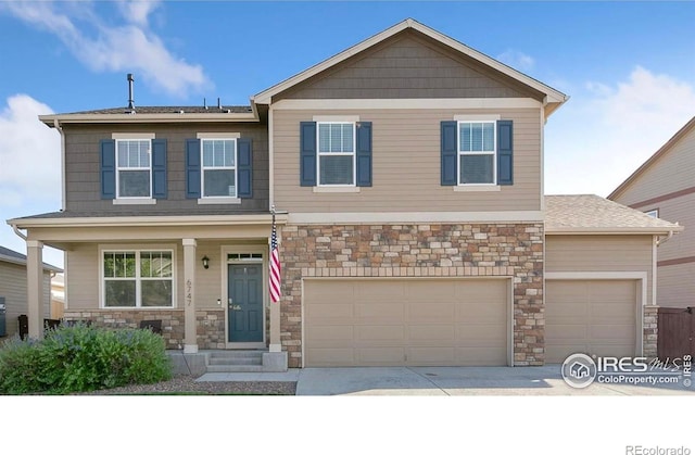 craftsman-style house with an attached garage, covered porch, stone siding, and concrete driveway