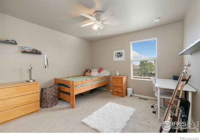 bedroom featuring baseboards, carpet, a ceiling fan, and visible vents