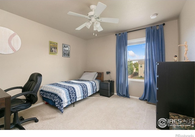 bedroom with carpet floors, baseboards, and a ceiling fan