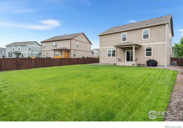 6747 Grainery Rd, Timnath, CO 80547 - rear view of house featuring central air condition unit