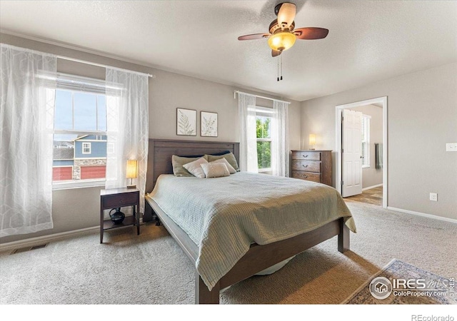 6747 Grainery Rd, Timnath, CO 80547 - carpeted bedroom featuring baseboards, a ceiling fan, and ensuite bath