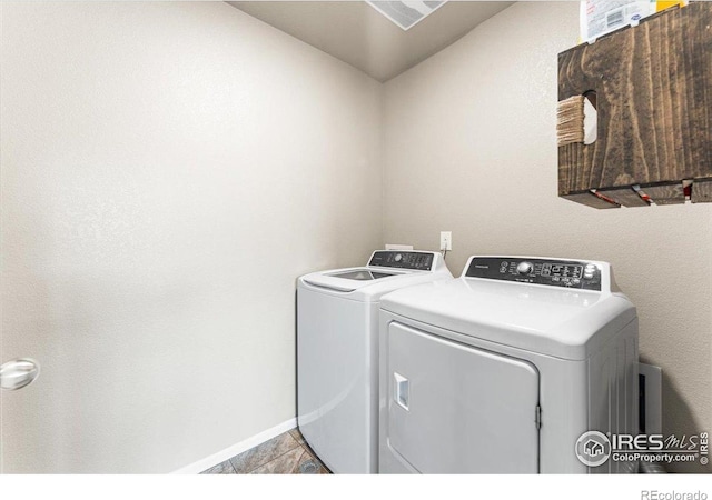 6747 Grainery Rd, Timnath, CO 80547 - laundry area featuring washing machine and dryer and baseboards