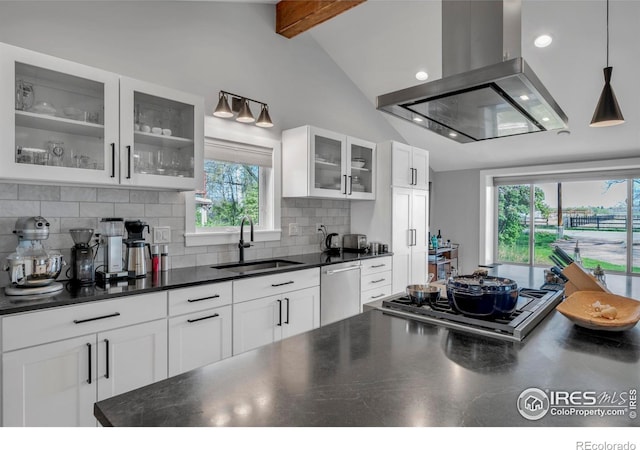 kitchen featuring dark countertops, range hood, vaulted ceiling with beams, a sink, and stainless steel appliances