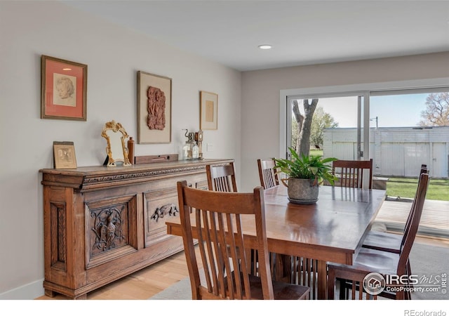 dining space featuring recessed lighting and light wood finished floors