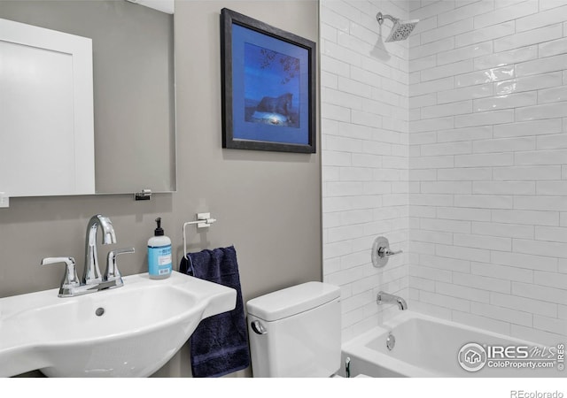 full bathroom with a sink, bathing tub / shower combination, and toilet