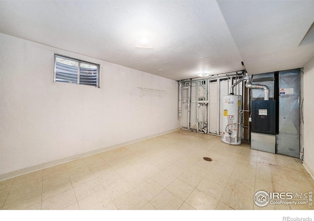 basement featuring gas water heater, tile patterned floors, baseboards, and heating unit