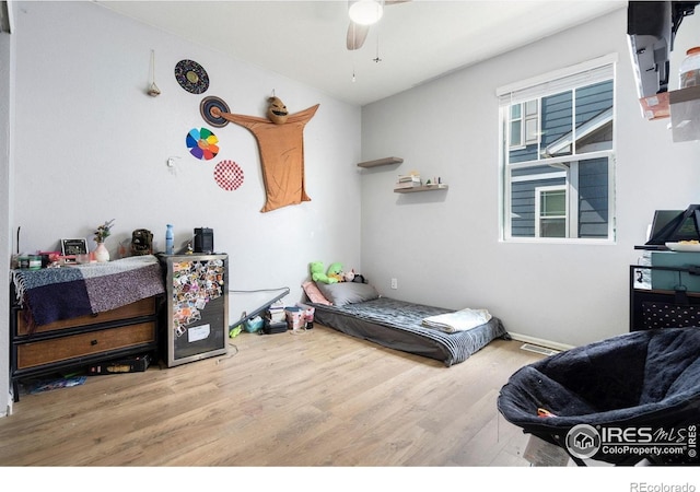 2000 Rose Petal Dr, Windsor, CO 80550 - bedroom with wood finished floors and a ceiling fan