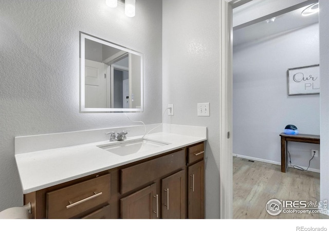 2000 Rose Petal Dr, Windsor, CO 80550 - bathroom featuring wood finished floors and vanity