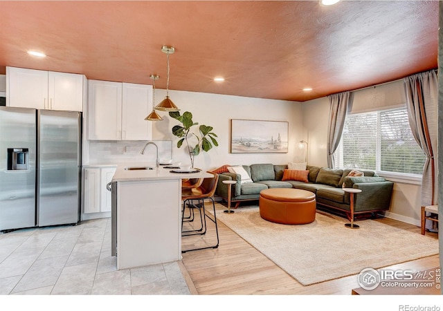 living room featuring recessed lighting and baseboards