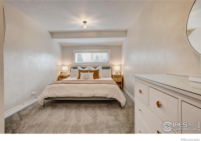 carpeted bedroom with baseboards
